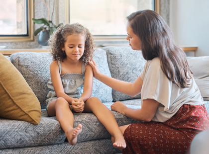 Loving caring mother trying to communicate with upset daughter.