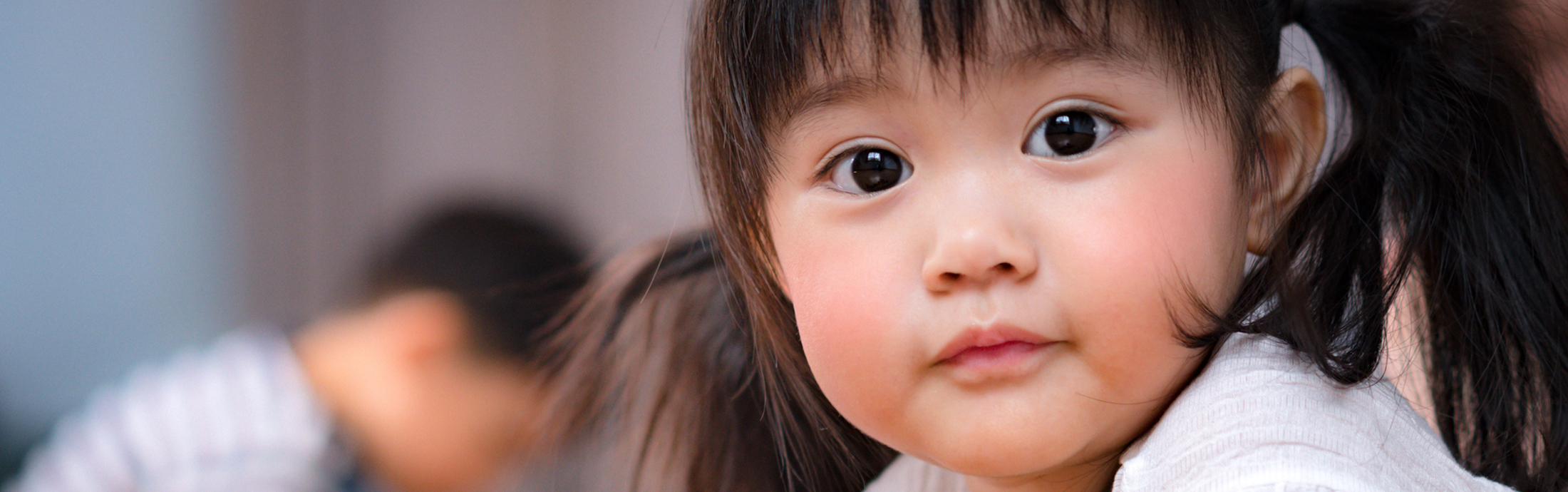 Close up of young girl with big brown eyes.