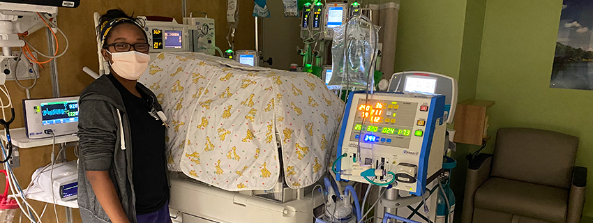 Sidney Garrett working in CHKD's NICU